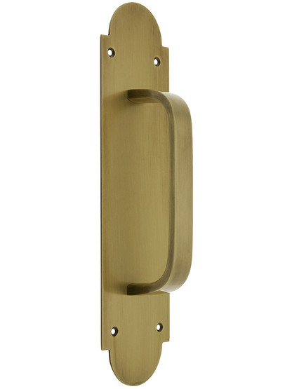 Solid Brass Modern Door Pull With Arched Back Plate in Antique Brass.